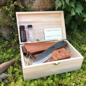 A box with some knives and other items in it