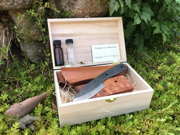 A box with some knives and other items in it