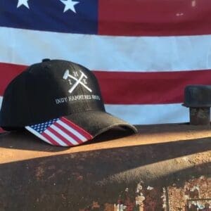 A baseball cap sitting on top of a wooden table.