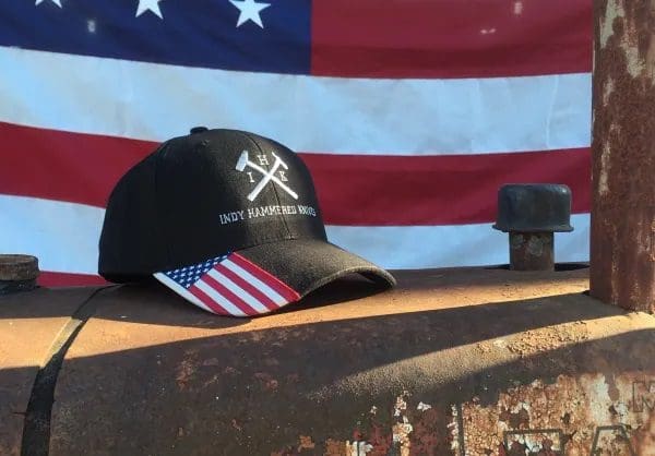 A baseball cap sitting on top of a wooden table.