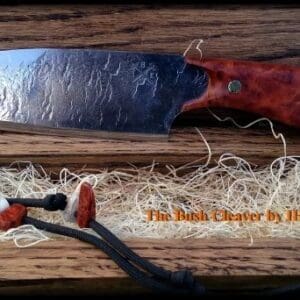 A knife and some tools on top of wood.