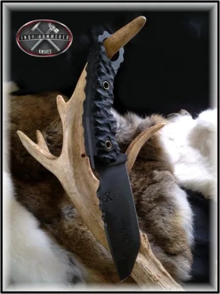 A knife that is on top of some antlers.